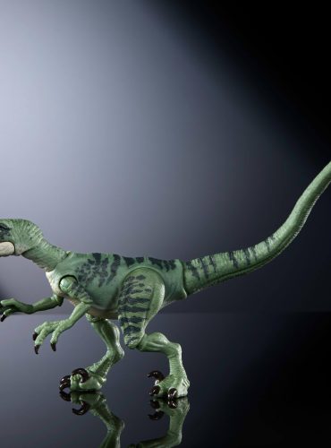 "Jurassic World Velociraptor Delta action figure with lifelike articulation, realistic eyes, posable tail, and movie-accurate design."