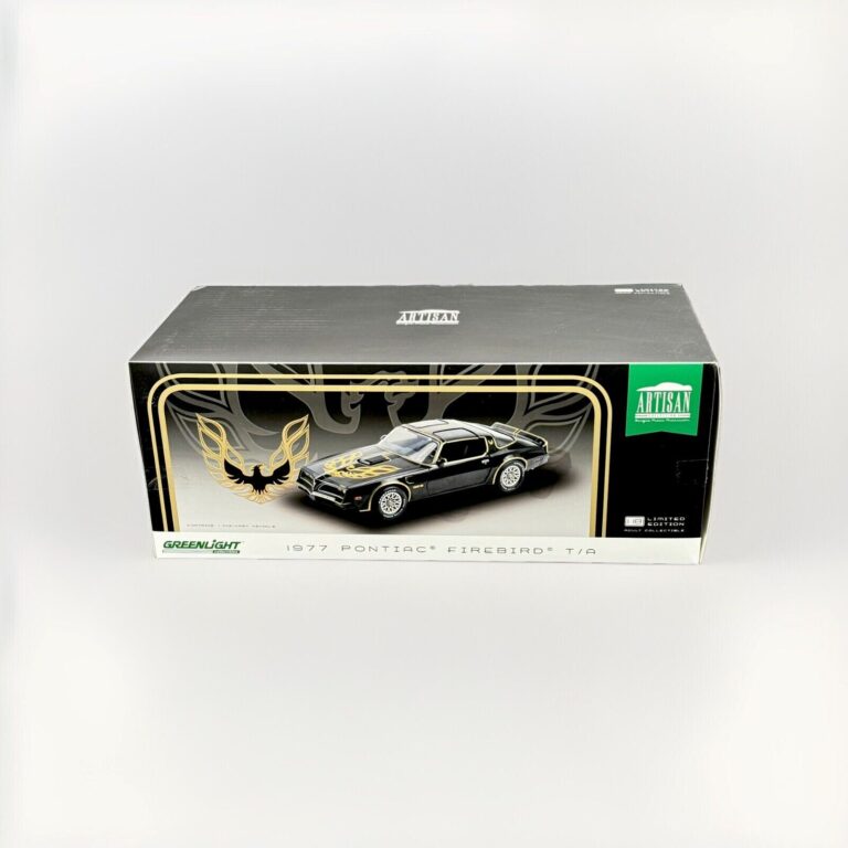 "1977 Pontiac Firebird Trans Am diecast model in Starlite Black by Greenlight Artisan, 1:18 scale in original box, like-new condition."