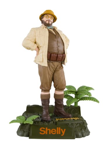 "McFarlane Movie Maniacs Professor Sheldon Oberon 6-inch figure from Jumanji, detailed with film-accurate accessories and backdrop."