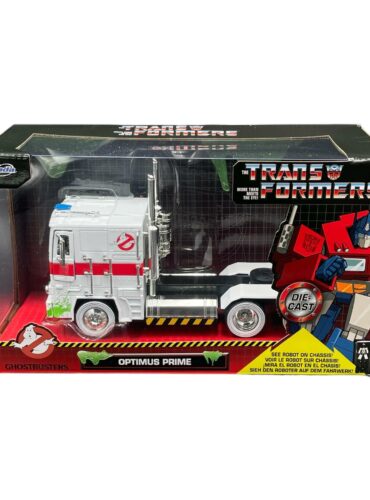 "1:24 scale diecast Optimus Prime semi-truck in Ghostbusters theme with opening doors, hood, trunk, and detailed interior."