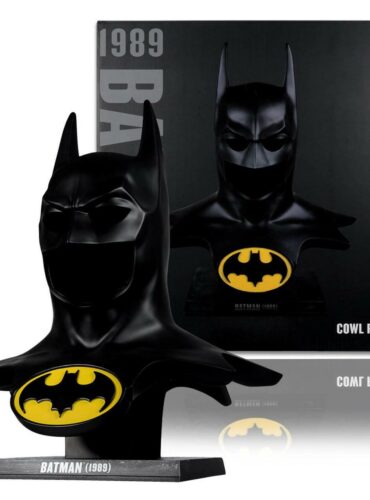 "1:1 scale replica of the 1989 Batman cowl by McFarlane DC Direct, standing 24.5 inches tall on a display stand."