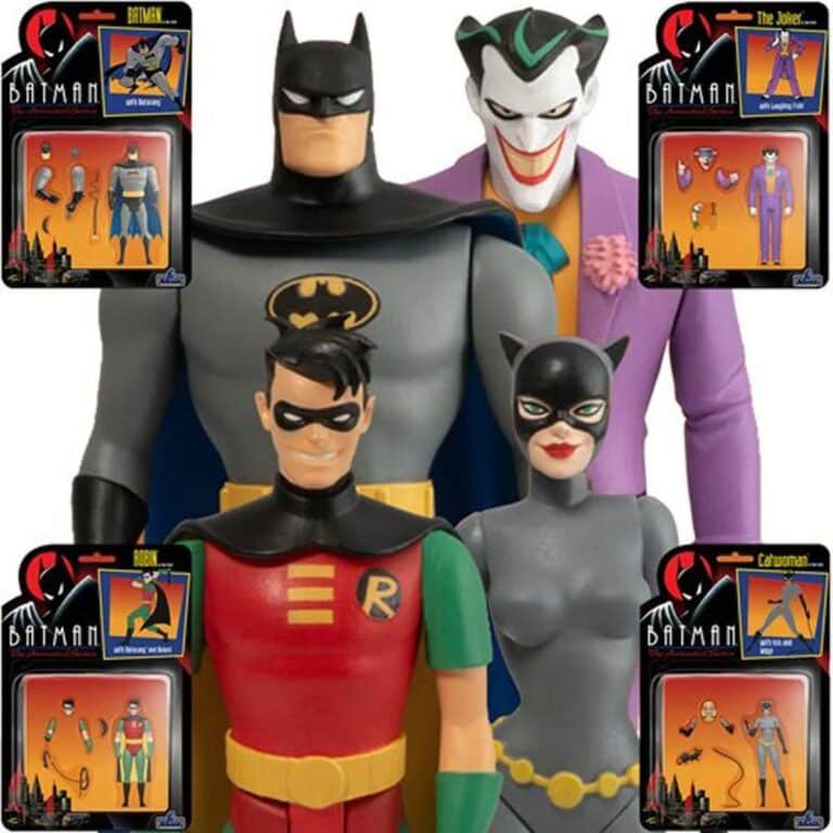 "Set of four Mezco Toyz Batman action figures including Batman, Robin, The Joker, and Catwoman with interchangeable heads and accessories."